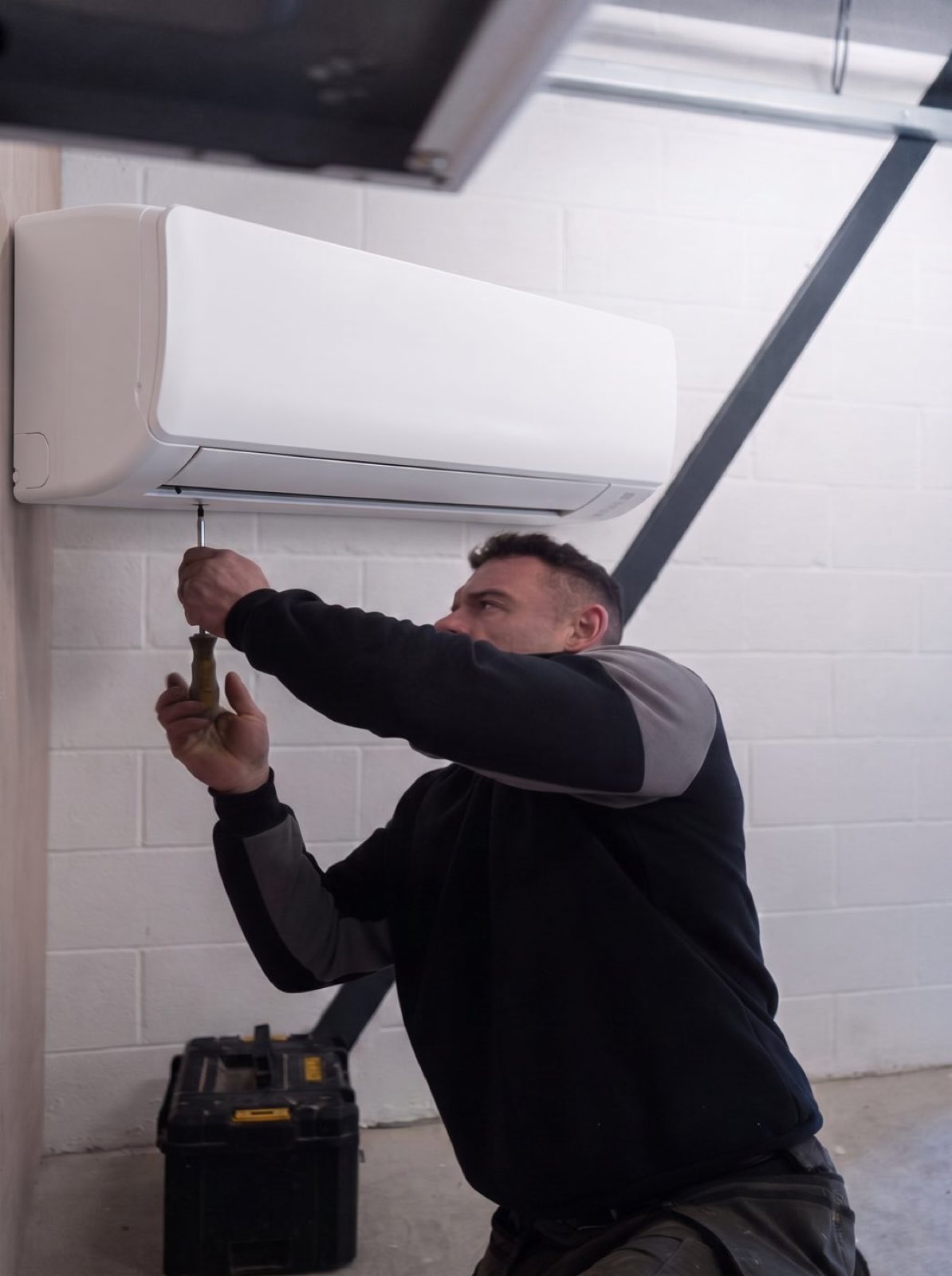 Ryan, the engineer behind Air Conditioning MCR, at work